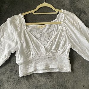 PACSUN Women’s Large L/S cropped white wrap shirt.